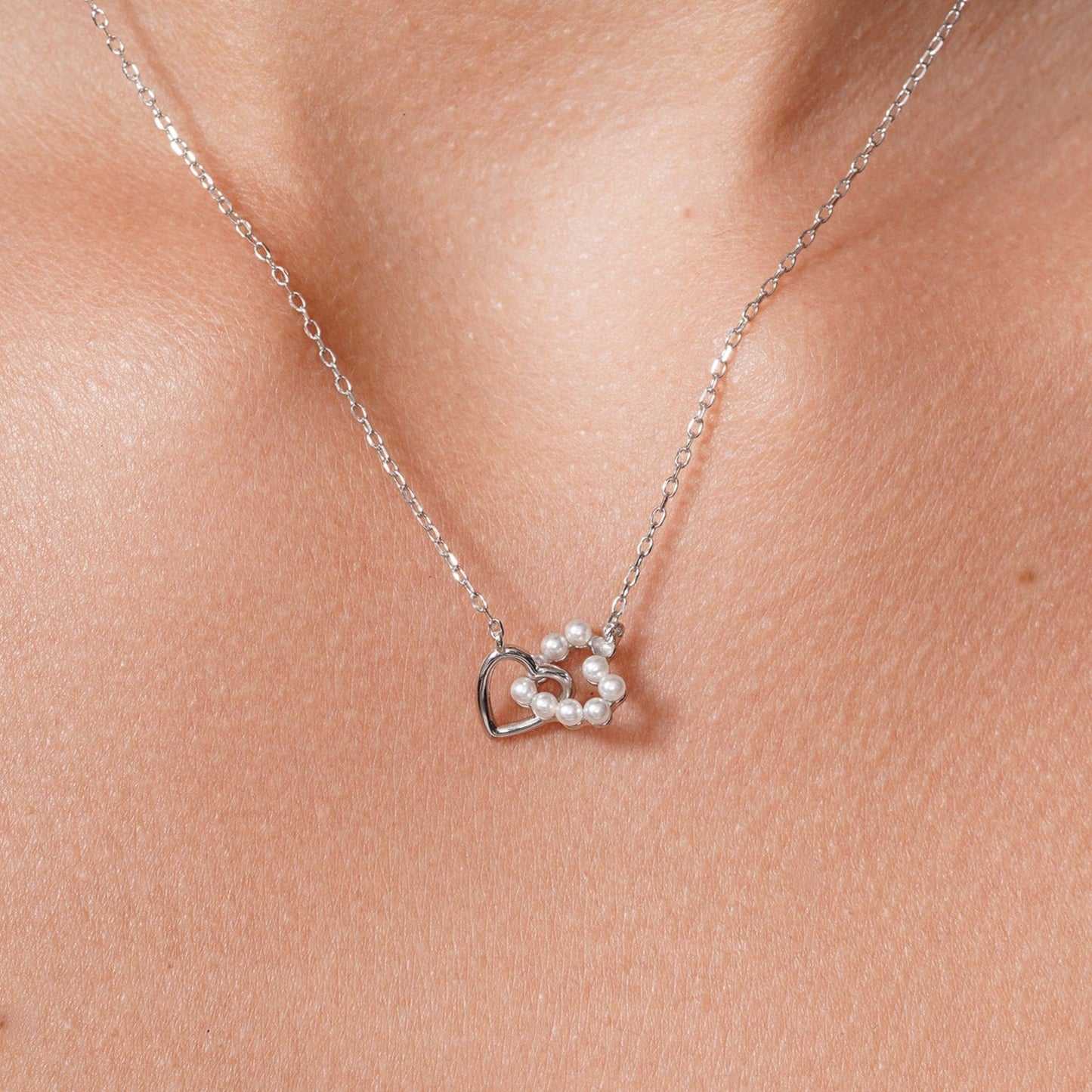 Rhodium Plated 925 Sterling Silver Intertwined Synthetic Pearl Heart Adjustable Necklace - JTN00002