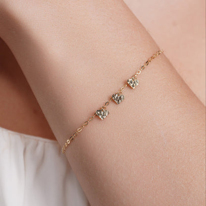 14KB0012. - 14 Karat Yellow Gold Three Diamond Cut Heart Charm Adjustable Bracelet