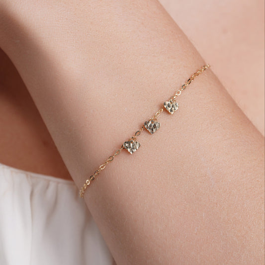 14KB0012. - 14 Karat Yellow Gold Three Diamond Cut Heart Charm Adjustable Bracelet