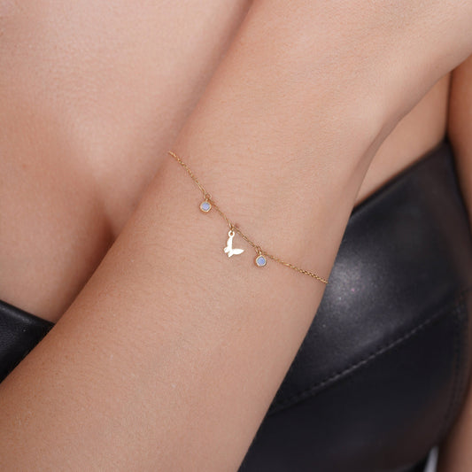 14KB0013. - 14 Karat Yellow Gold Butterfly and Round Opal Charms Adjustable Bracelet