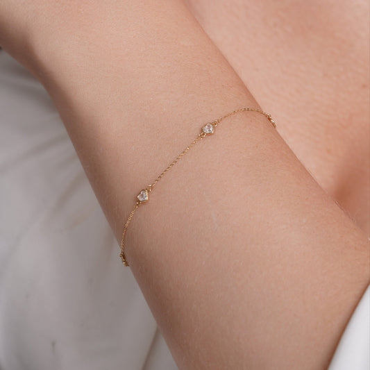 14KB0001. - 14 Karat Yellow Gold Multi Heart Clear CZ Charm Adjustable Bracelet