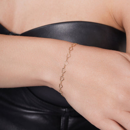 14KB0008. - 14 Karat Yellow Gold Multi Heart Charms Adjustable Bracelet