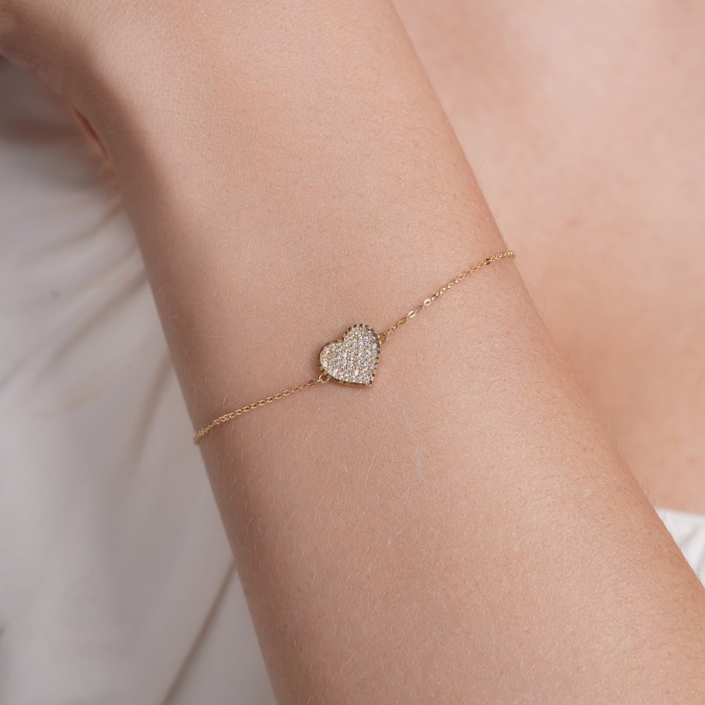 14KB0011. - 14 Karat Yellow Gold Diamond Cut Heart Studded CZ Charm Adjustable Bracelet