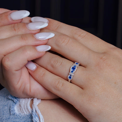 Silver 925 Rhodium Plated Knotted Blue CZ Ring - BGR01112BLU